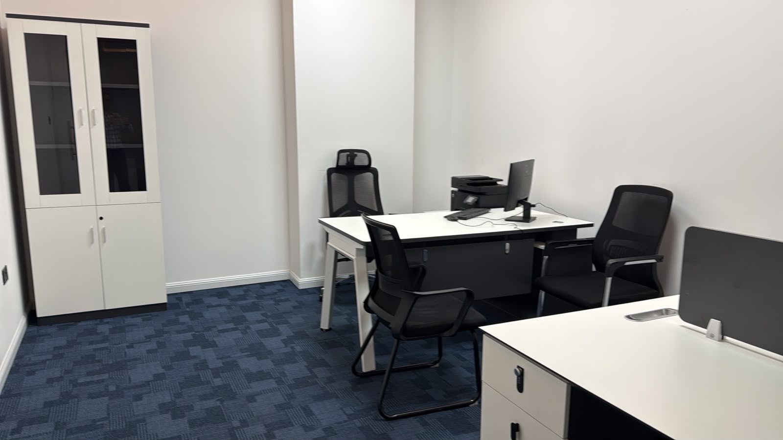 Desks and meeting chairs inside the Al Taali Dubai office